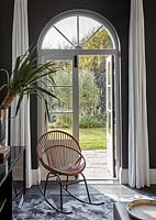 Modern rocking chair by patio doors