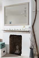 Accessories on rustic mantlepiece