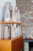 Retro pottery on shelving unit