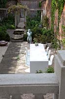 Formal courtyard garden with modern furniture