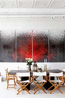 Modern open plan dining area with art by Yasmina Alaoui