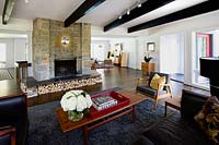 Modern living room with stone chimney breast
