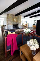 Modern living room with stone chimney breast
