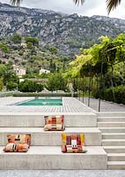 Colourful seating area by pool