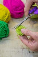 Making christmas pompom decorations - Trim the ends of your pompom to keep it neat and tidy 