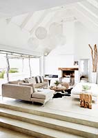 White living room with vaulted ceiling