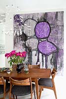 Colourful painting in dining area