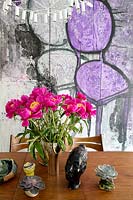 Vase of Peonies on dining table