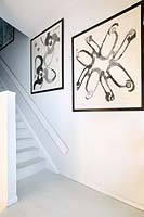 Black and white paintings in hall