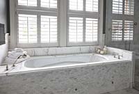 Bath with marble splashback