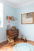 Cane furniture in childs bedroom