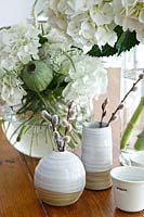 Vases of Pussy willow stems and Hydrangea flowers