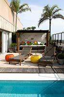 Roof terrace with pool and covered seating area