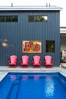 Colourful chairs by pool