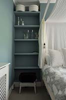 Shelves beside bed