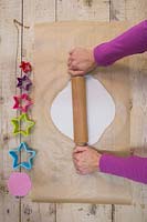 Making clay stars - Use a rolling pin to stretch out the modelling clay