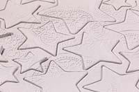 Making clay stars - a variety of different sized stars cut out from the modelling clay showing the silicone mould pattern