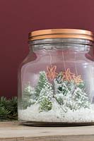 Making copper wire stars - finished decorations hanging inside a miniature Christmas themed glass jar