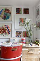Artists desk with colourful art display