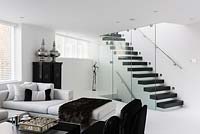 Open plan seating area with staircase
