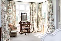 Floral curtains in  bedroom