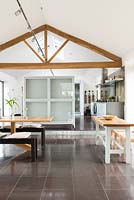 Contemporary dining area with tiled flooring