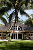 House surrounded by palm trees