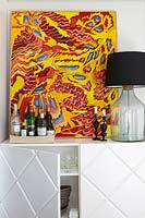 Colourful painting on cabinet