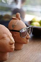 Ceramic heads on table