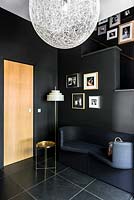 Black hallway with sofa