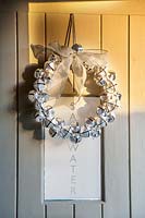 Silver metal wreath on door