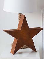 Rusty metal star on bedside table