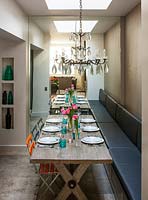 Dining area with wooden table and banquette seating