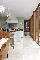Open plan kitchen with tiled flooring