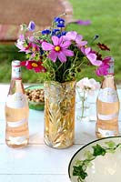 Cosmos and Cornflowers in gold vase