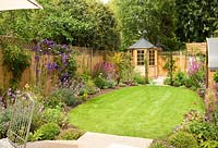 Lawned garden with colourful flowerbeds