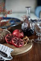 Pomegranates on wooden platter