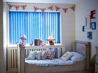 Childs bedroom with vertical blinds