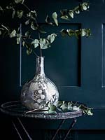 Eucalyptus foliage in silver vase