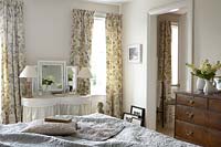 Patterned curtains in bedroom