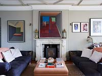 Colourful painting above period fireplace