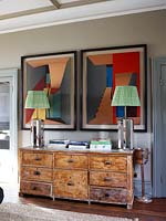 Modern lamps on vintage chest of drawers
