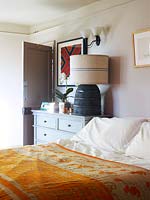 Modern lamp on bedside cabinet