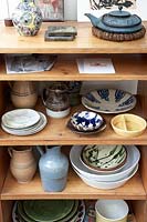 Patterned ceramics on wooden shelves