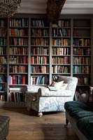 Armchair by bookshelves