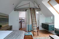 Coastal style bedroom with mezzanine