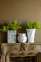 Faux houseplants in white pots