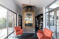 Modern pendant light in front of classic mirror
