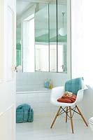 Eames chair beside bath