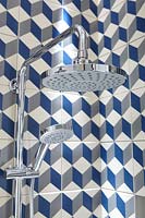 Patterned tiles in shower cubicle
